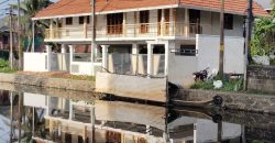 Serene Canal-Side Living – 5.5 Cent Homestay Property in Chungam
