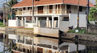 Serene Canal-Side Living – 5.5 Cent Homestay Property in Chungam