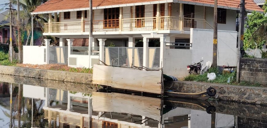 Serene Canal-Side Living – 5.5 Cent Homestay Property in Chungam
